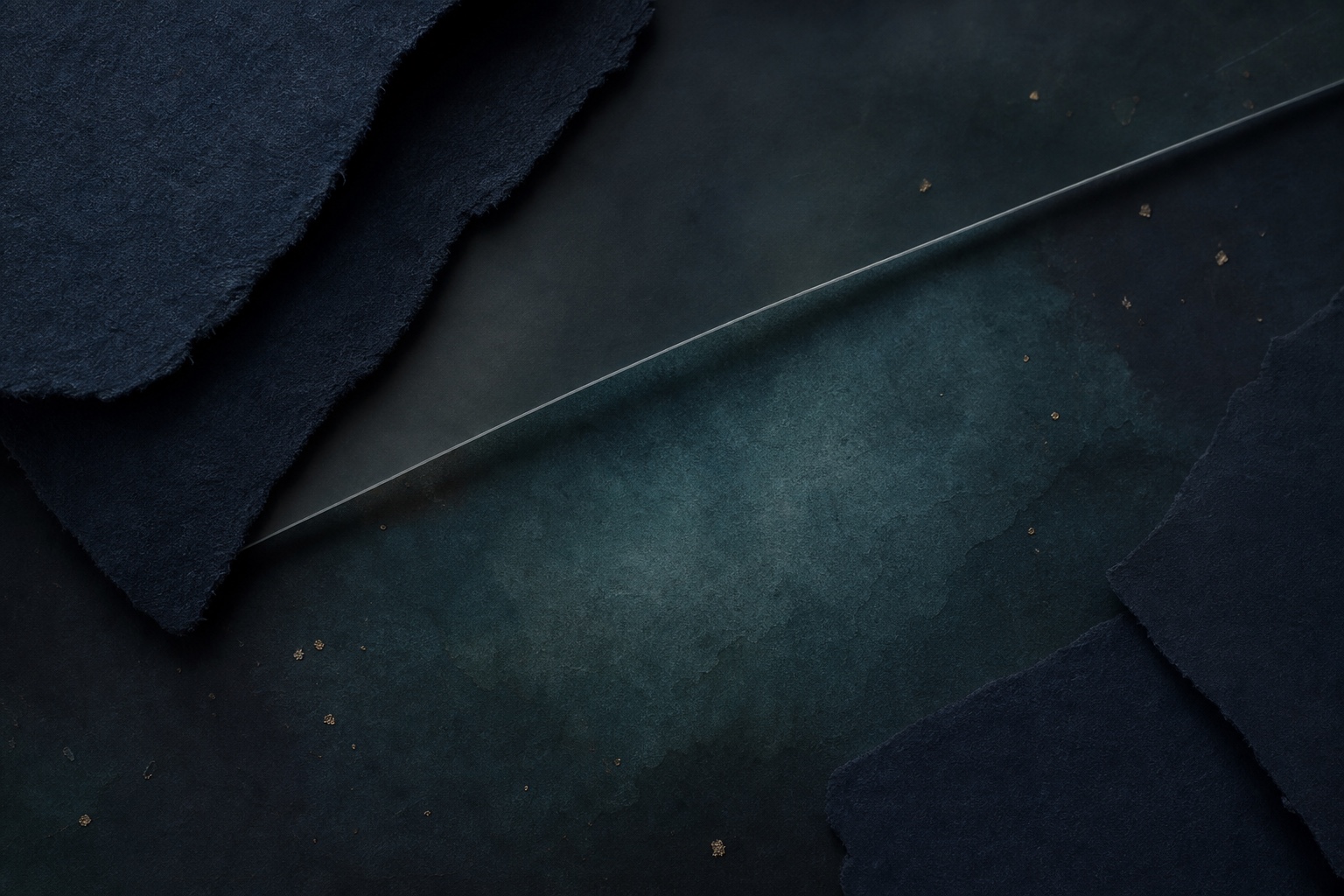 A dark teal and charcoal material study